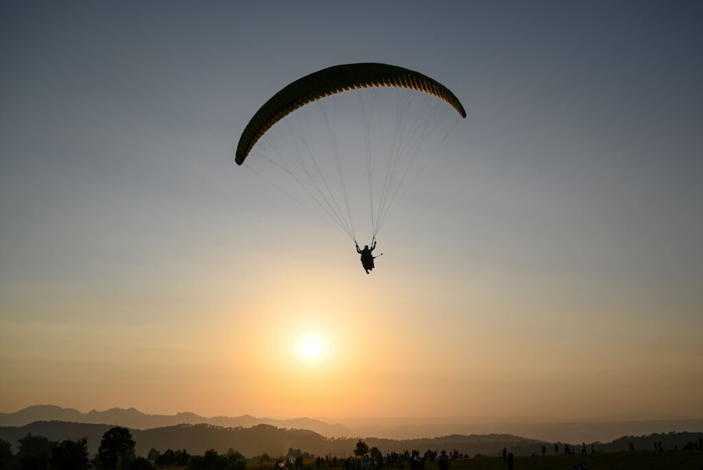 paraglider pilot fly sky with beautiful sunset paragliding concept
